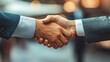 © SY - Close-up shot of two businessmen shaking hands. Illustrates agreement, partnership, and success.