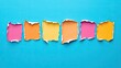 © CassiOpeiaZz - Colorful torn paper pieces on a blue background create a vibrant, eye-catching visual perfect for creative design or artistic projects.