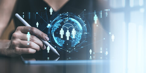 Fototapete - Hand holding stylus pen interacting with digital tablet displaying social network icons and global connections on bright background.