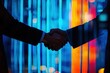 © kribbox - Businessmen shaking hands against vibrant city lights.