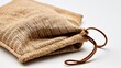 © TheStoodio - Handmade burlap pouch mockup with brown drawstring for eco-friendly product packaging.