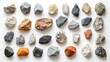 © FairValue Stock - Collection of small pebbles spread across a white surface