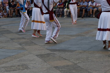 Wall Mural - Basque folk dancers in an outdoor festival