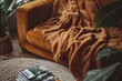 © Larisa - Warm hues of retro fabric draped over cozy couch create inviting