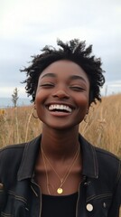 Wall Mural - Woman with curly hair and freckles smiling brightly in a warm atmosphere