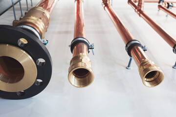 Canvas Print - pipes are shown in the image, with one of them being a black pipe. The other two pipes are made of copper and are connected to a black pipe