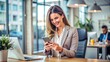 © engincan - Smiling young professional business woman, happy businesswoman holding smartphone standing in office using mobile looking at cell phone, texting on cellphone, typing on cellular technology device.