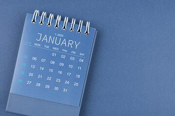 Wall Mural - January 2025 calendar on blue color background. Desk calendar for planning.