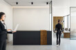 © Who is Danny - Modern office reception area with a businessperson walking towards a meeting room with a stylish design.