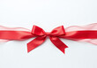 © Galeno - white backgroundting bright red satin ribbon creates delicate fluttering