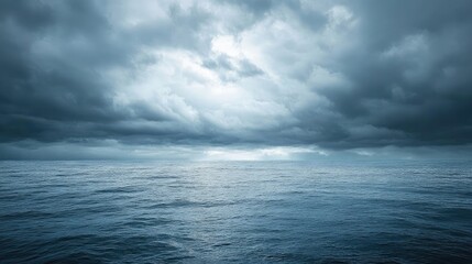 Canvas Print - Dramatic Seascape Under Cloudy Skies with Light Breaking Through Gray Storm Clouds