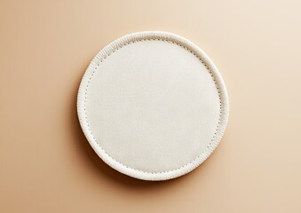 A standalone rounded embroidered patch mockup featuring distinct circular stitches on a plain white background, ready for a custom icon or logo design, perfect for branding and apparel