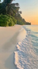 Wall Mural - Peaceful beach scene at sunset with gentle waves lapping the shore. The sandy beach is surrounded by lush greenery and palm trees under a soft orange sky.