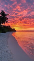 Wall Mural - Stunning tropical sunset over the calm sea with vibrant colors. Palm trees line the sandy beach creating a serene and peaceful landscape moment.