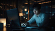 © kvladimirv - Focused Young Professional Working Late at Night in Modern Office Space