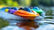 © aritha - Colorful remote-controlled boats racing on a calm water surface.