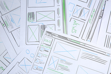 Leinwandbilder - Developing UI design. Sketches of website wireframes as background, top view