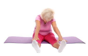 Sticker - Senior woman exercising with fitness mat on white background