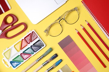 Poster - Designer's workplace. Flat lay composition with stationery and laptop on yellow background