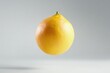 © Ruslan - Grapefruit on a white background soaring in the air