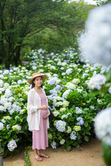 Sticker - Pregnant woman in hydrangea flower farm garden