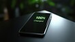© KYR - A close-up of a smartphone screen with a green '100 Charged' icon glowing brightly on a minimalist surface.