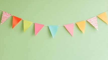 Poster - Colorful paper party bunting flags strung on a light green wall.