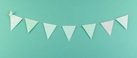 Poster - Mint green patterned triangle bunting hanging on a teal background.