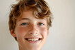© vectorman92 - Close-up portrait of a joyful Caucasian teenage boy with a genuine smile and confident eyes