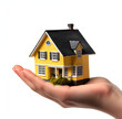 © Anuson - hand holding house on white