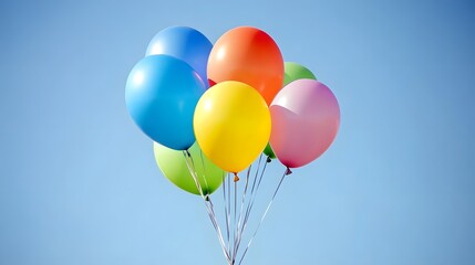 a joyful release of colorful balloons rising into the air against a clear blue sky
