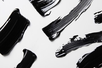Poster - Abstract black paint strokes on a white background for artistic purposes.