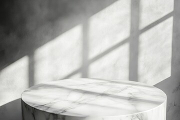 Marble pedestal in sunlit room.