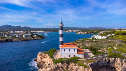 Sticker - Portocolom lighthouse guiding ships in beautiful mallorca, spain