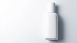 © Sergei - top-down view of minimalist nail polish bottle with blank white label placed elegantly on plain white surface