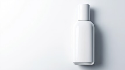 top-down view of minimalist nail polish bottle with blank white label placed elegantly on plain white surface