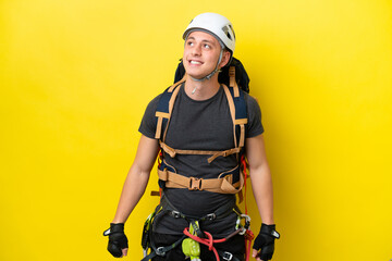 Wall Mural - Young rock climber Brazilian man thinking an idea while looking up