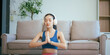 © NanSan - An Asian teenage girl exercises in her room to relax, stretch, and improve health.Regular exercise enhances endurance,strength, balance, emotional control, fitness, and aids in effective weight loss