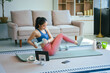 © NanSan - An Asian teenage girl exercises in her room to relax, stretch, and improve health.Regular exercise enhances endurance,strength, balance, emotional control, fitness, and aids in effective weight loss
