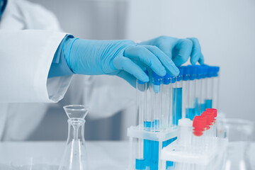 Aufkleber - A dedicated scientist is meticulously conducting a fascinating experiment using various test tubes in a wellequipped laboratory setting, exploring the depths of scientific inquiry and innovation