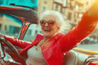 © nblxer - Happy trendy stylish aged woman driving the car