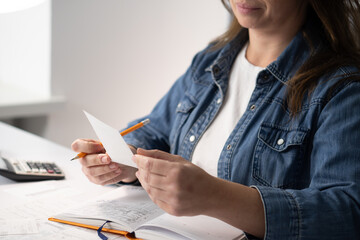 Poster - A woman is carefully analyzing her notes in a creatively designed workspace, reflecting on her ideas, and embracing a modern, minimalistic lifestyle while focusing on productivity and motivation
