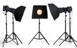 © ardanz - Three studio lighting setups with cameras, lights, and tripods on white background.