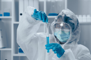 Aufkleber - A scientist is carefully conducting an intricate experiment involving a test tube within a wellequipped laboratory setting to explore various facets of biochemistry and healthcare innovations