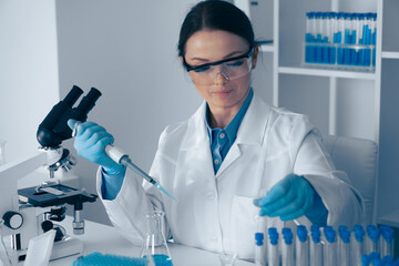 Aufkleber - Laboratory Research A dedicated scientist is meticulously conducting various experiments using a micropipette and an array of test tubes to advance our understanding in the field of science