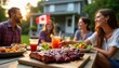 © miss irine - Friends, family gather outdoors for Canada Day barbecue. Enjoying grilled ribs, food, drinks. Canadian flag visible in background. Summer celebration in suburban backyard on beautiful evening.
