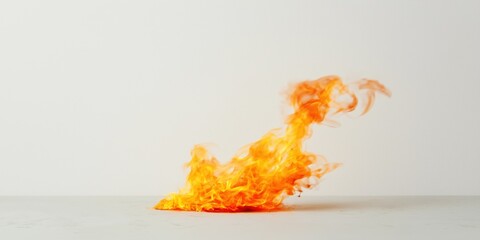 Wall Mural - A fire is burning on a white surface. The fire is orange and has a lot of smoke