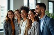 © miss irine - Happy business team stands together indoors. Diverse group of professionals smiling. Teamwork, success evident. Modern office environment. Photo captures positive energy in workplace setting. Look