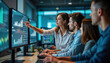 © miss irine - Young woman points at monitors showing data analysis charts. Colleagues watch closely. Team works together on data analysis, strategic planning in office. Collaborative tech business environment.