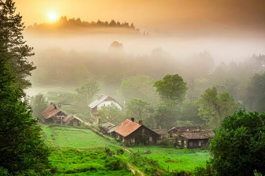 A Foggy Sunrise Over a Serene Village Landscape